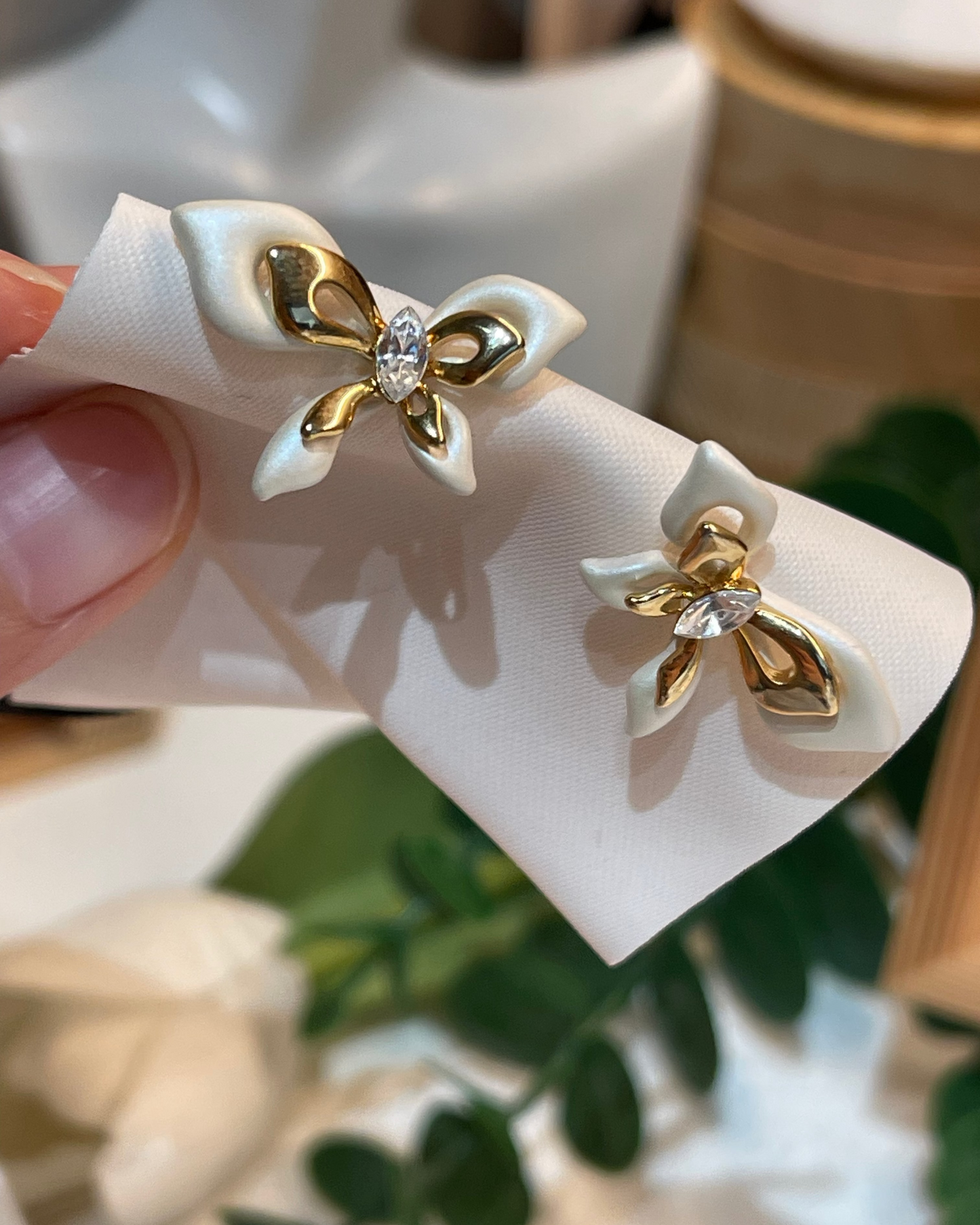 Ivory bow studs with gold accents #02353