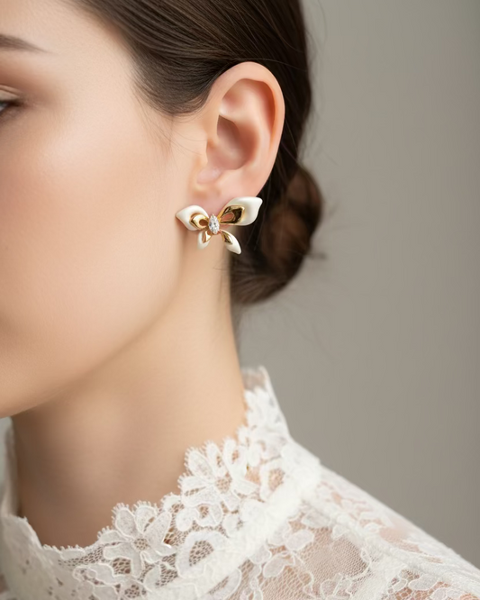 Ivory bow studs with gold accents #02353